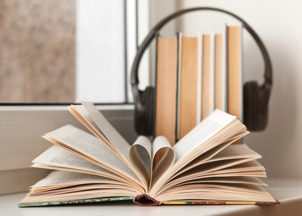 a book with headphones in the shape of a heart