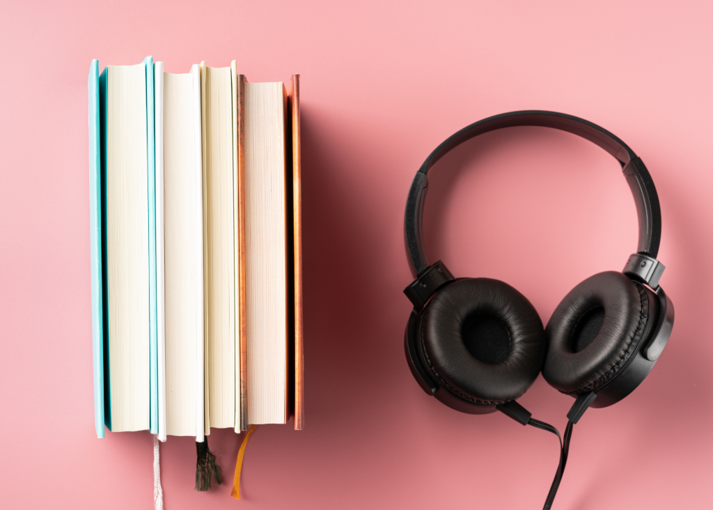 a stack of books and headphones