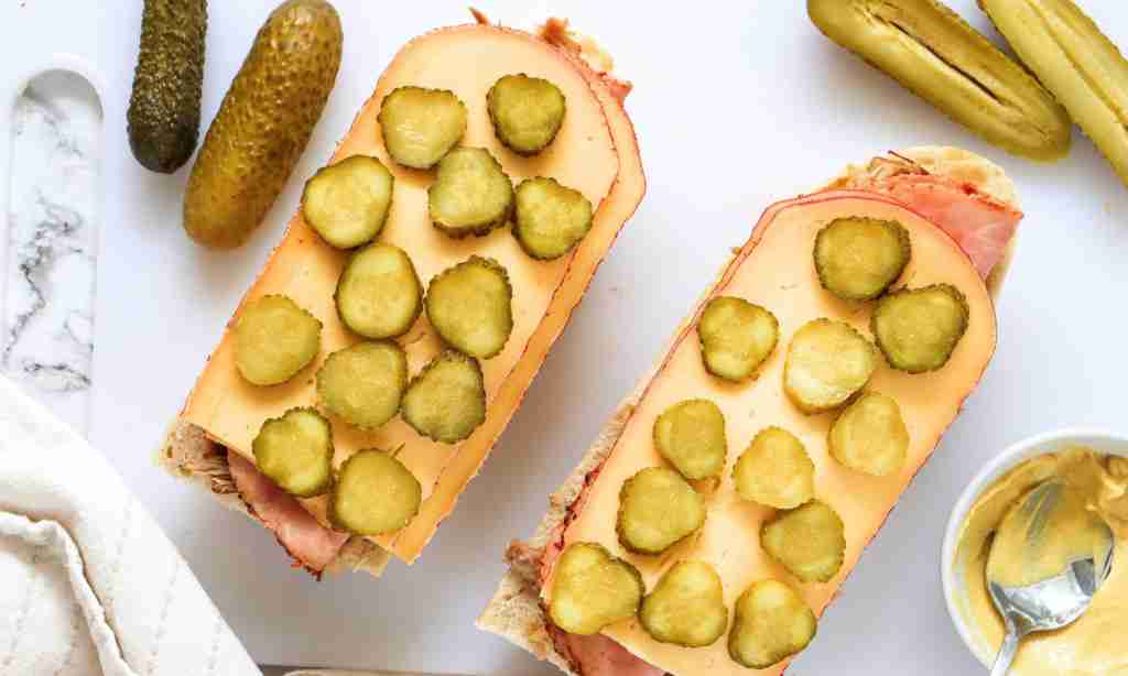 cuban sandwich pickles and cheese on a sandwich