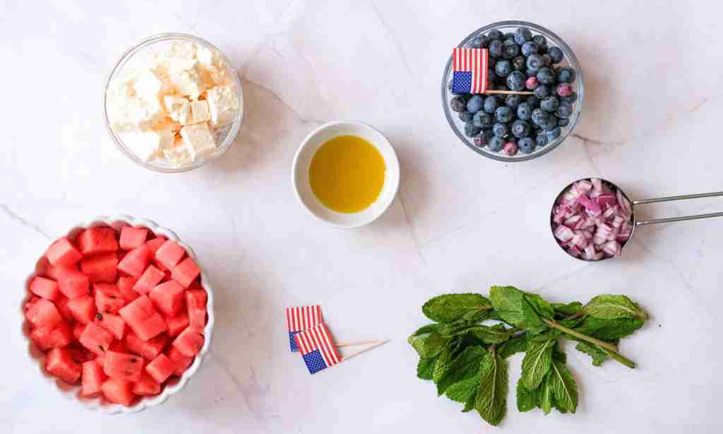 watermelon feta salad a table with different foods