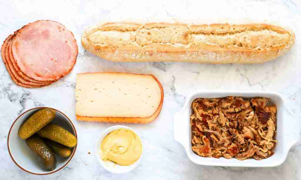 Cuban Sandwich Recipe a sandwich with meat and pickles