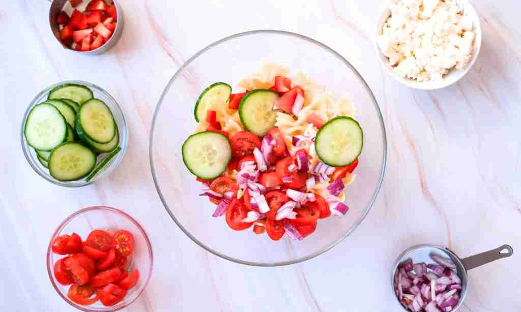 Mix the pasta salad in a bowl a bowl of pasta and vegetables