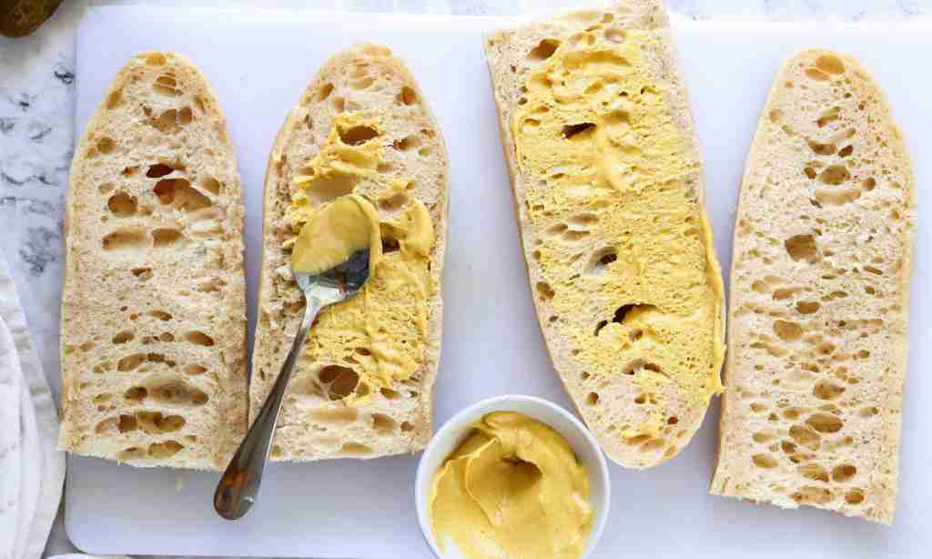 Cuban Sandwich Recipe slices of bread with mustard on it