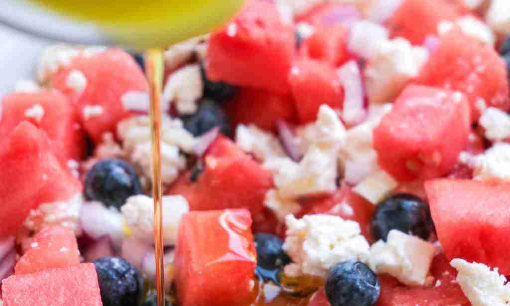 dress the salad a close up of food