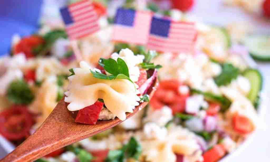 Chill and Serve the Pasta Salad a spoon with pasta and vegetables on it