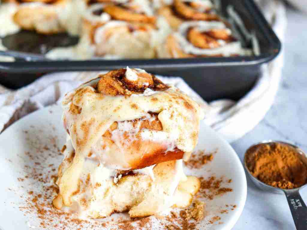 glaze the cinnamon rolls a plate of cinnamon rolls