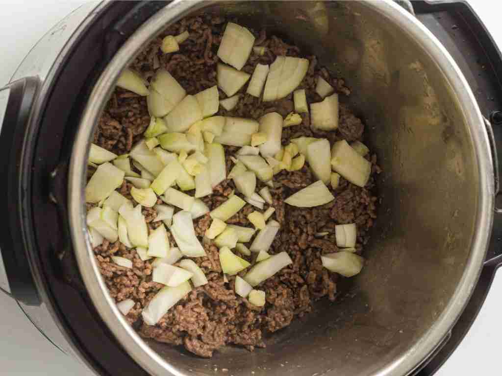 ground beef and diced onion a pot of ground beef and onions
