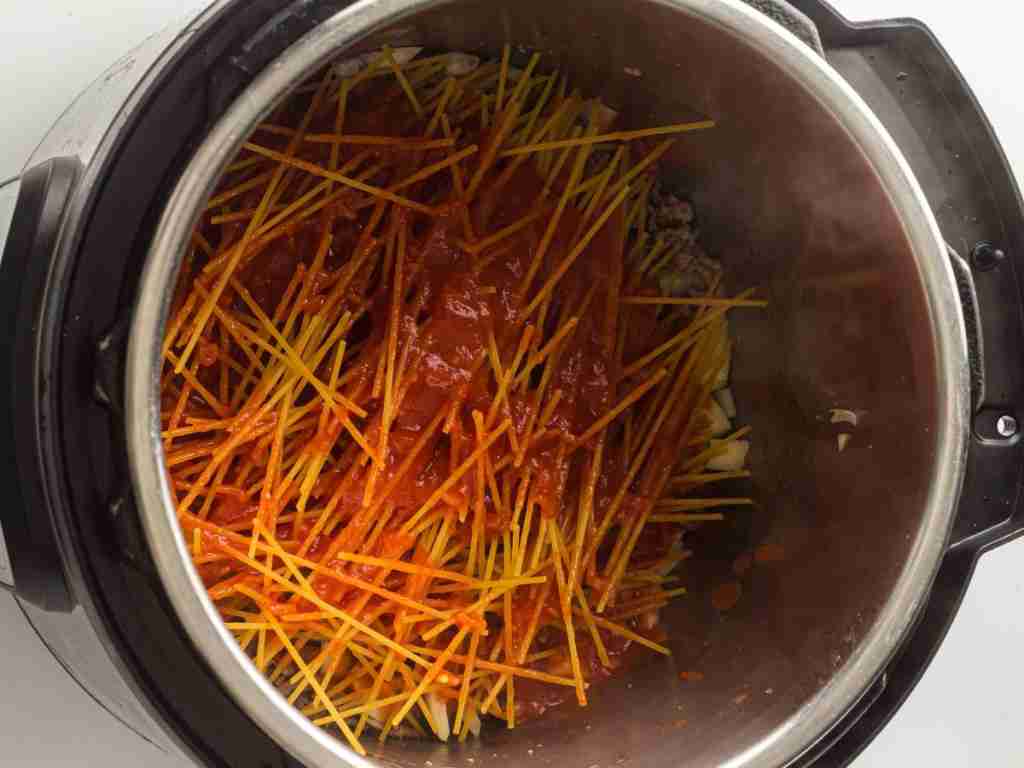 Pour sauce over pasta a pot of spaghetti and sauce