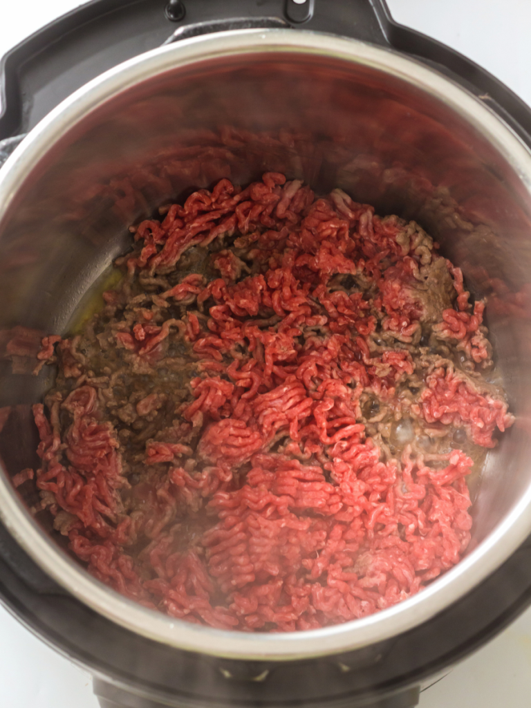 ground beef Raw ground beef in pressure cooker
