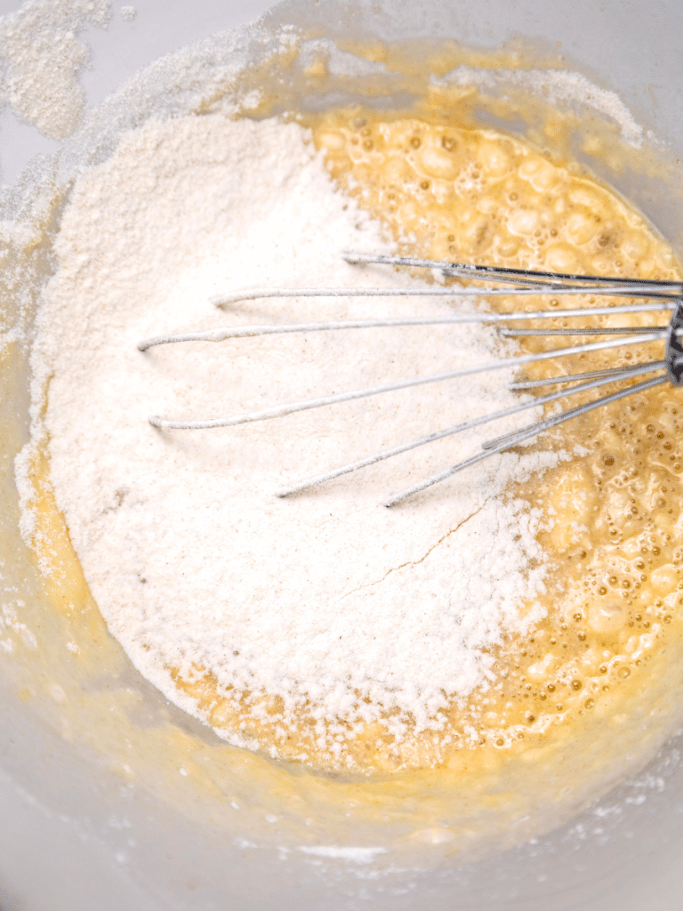 mixing ingredients Mixing batter with flour and whisk