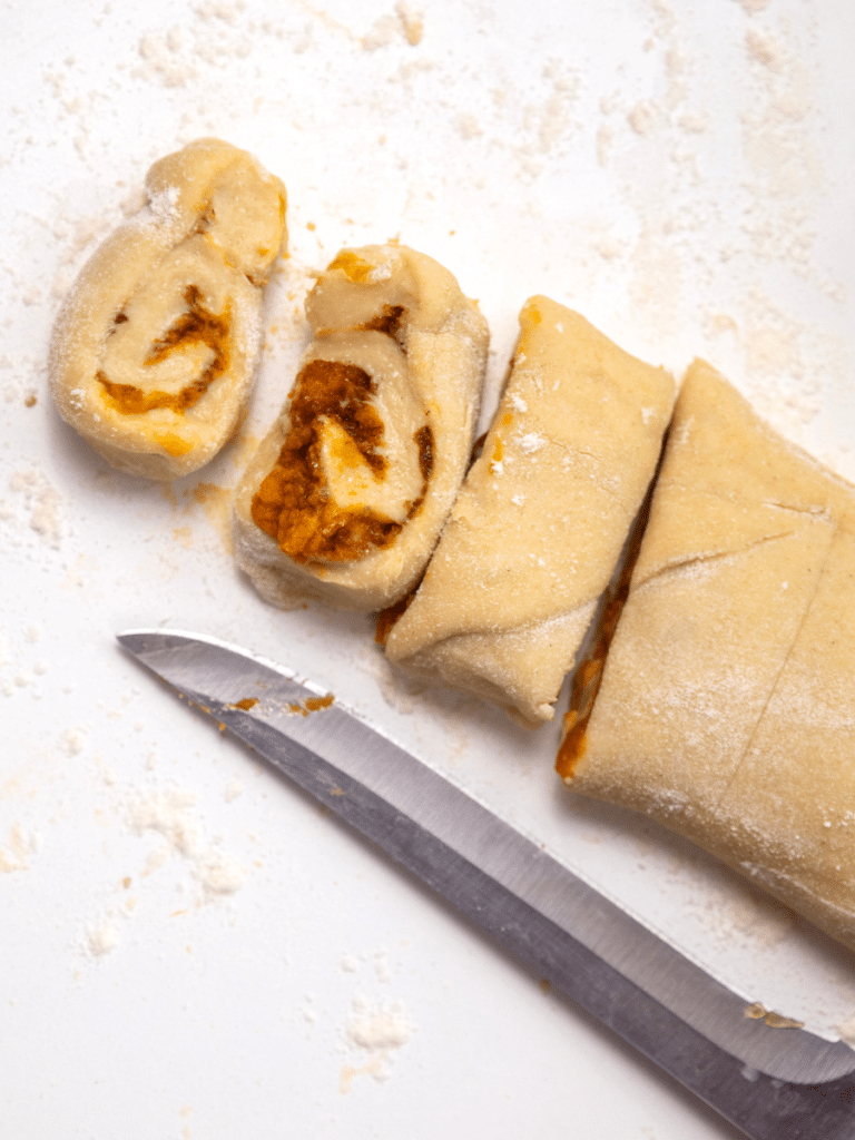 slicing the rolls Sliced dough with filling inside