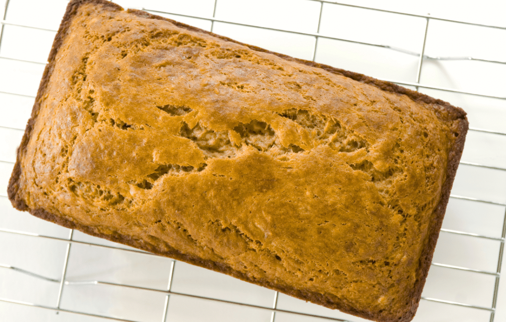 A loaf of banana bread A loaf of banana bread on a wire cooling rack