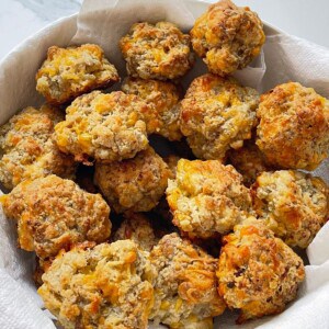 sausage balls with cream cheese in a white bowl