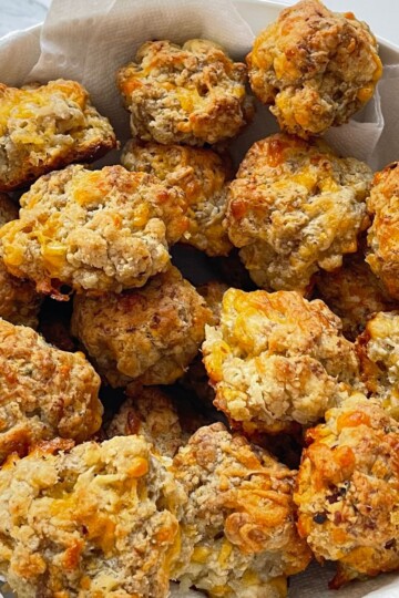 sausage balls with cream cheese in a white bowl