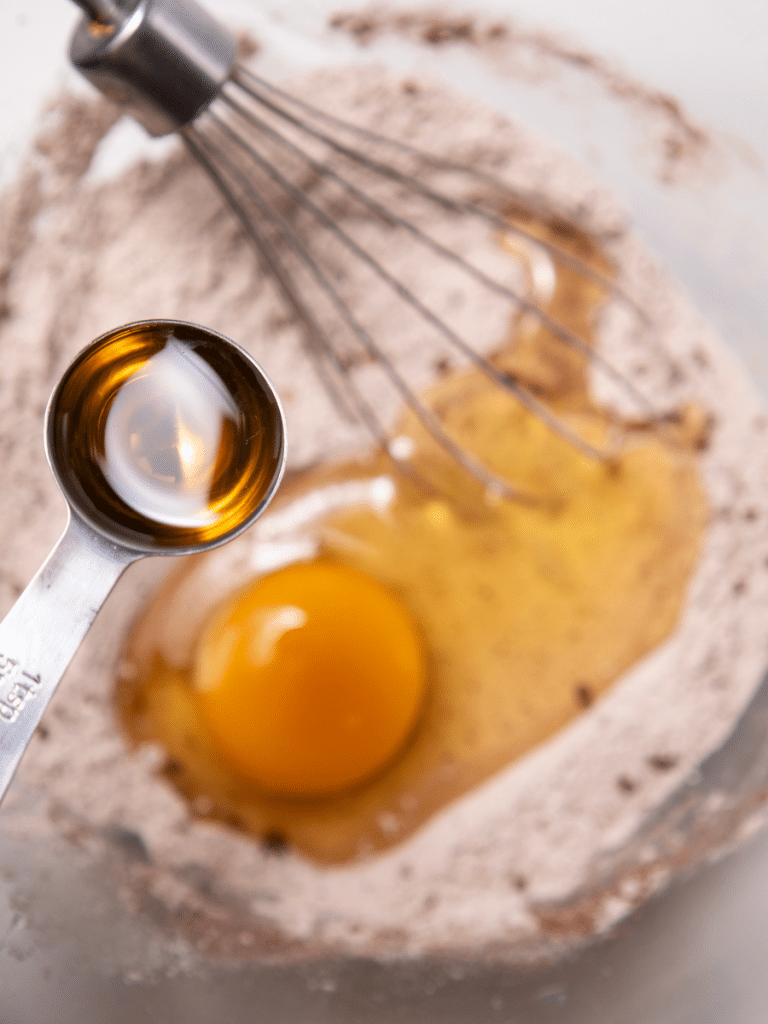 pancake ingredients Egg and ingredients in mixing bowl