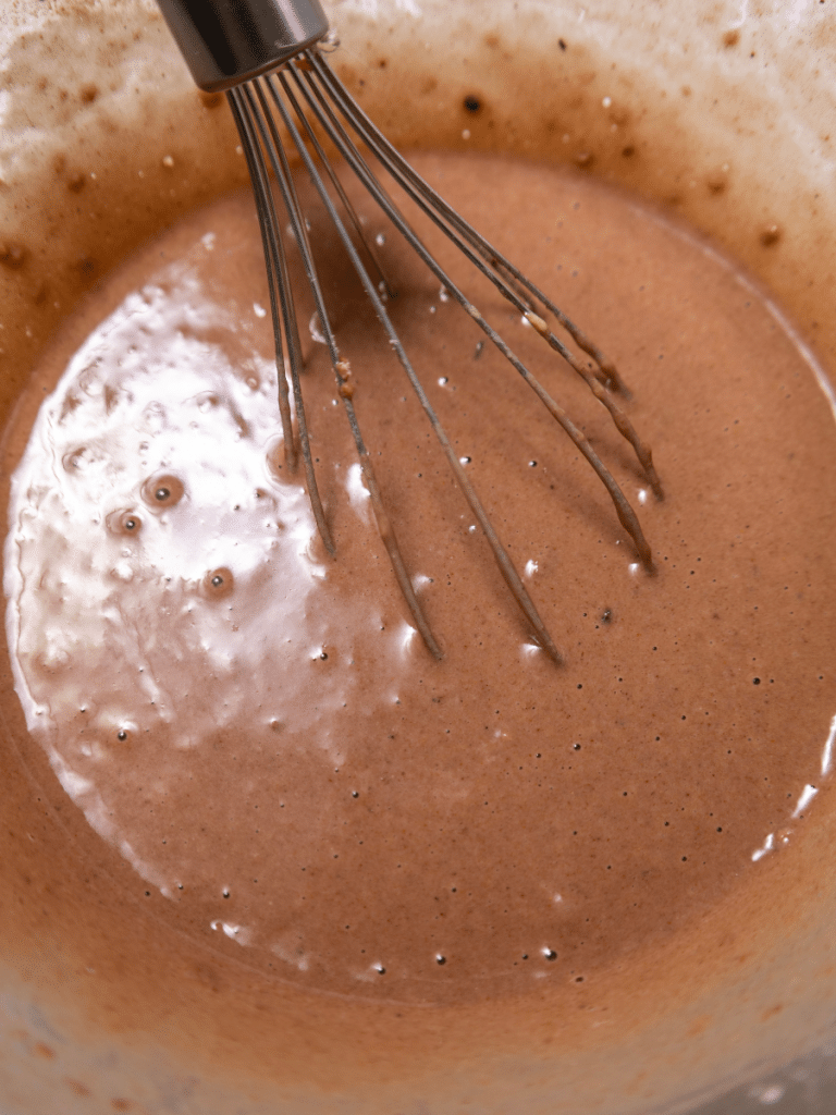 mix ingredients together Chocolate batter in mixing bowl