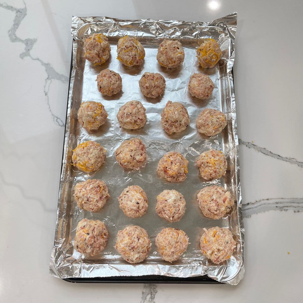 sausage balls on baking pan