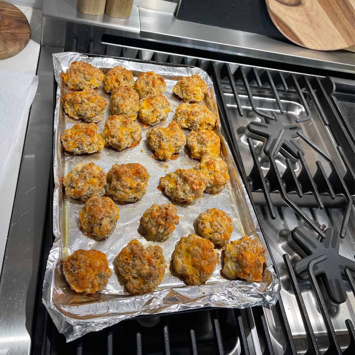 Sausage Balls Lots of rolled sausage balls on a pan lined with aluminum foil