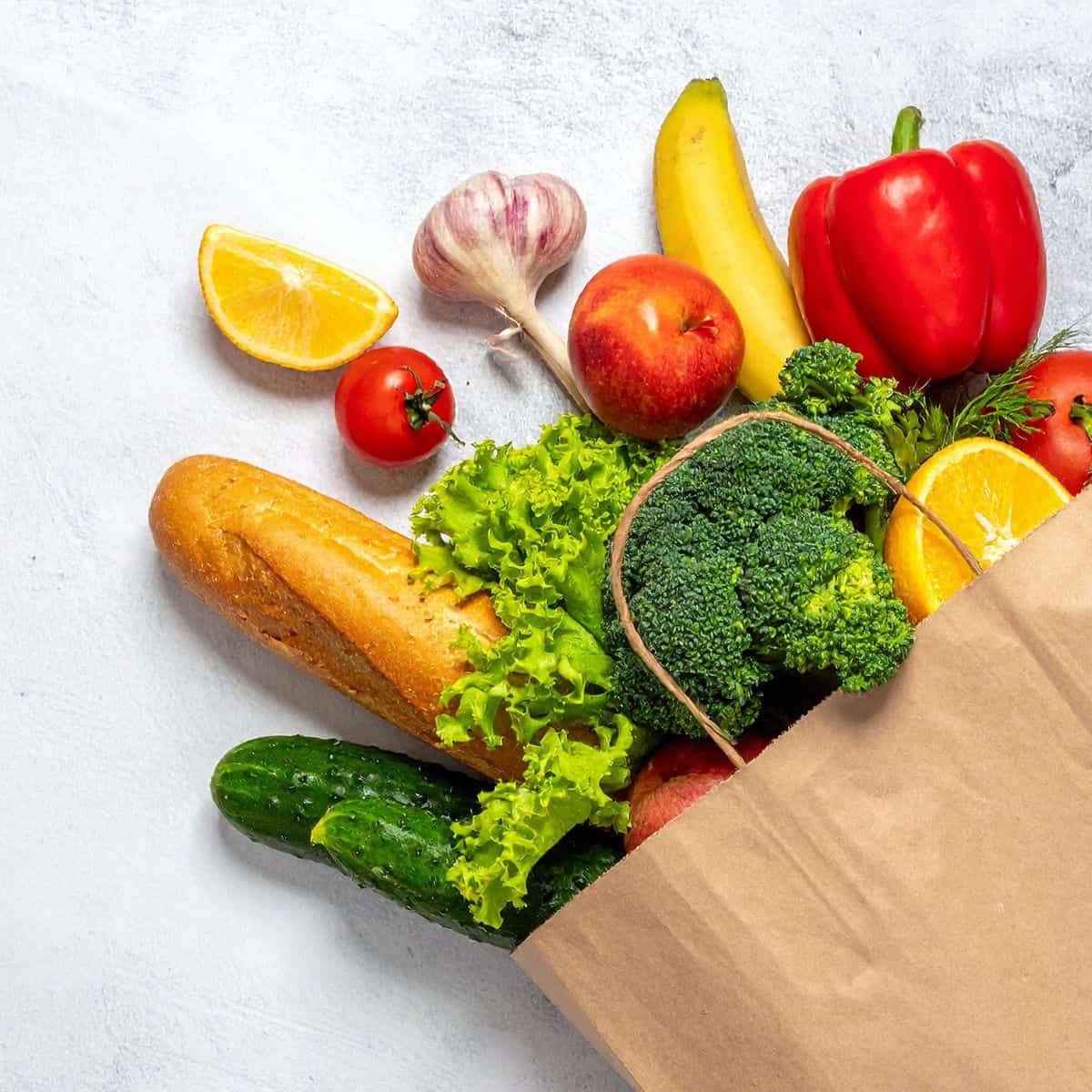 A bag of groceries A bag or groceries flatlay on a white table