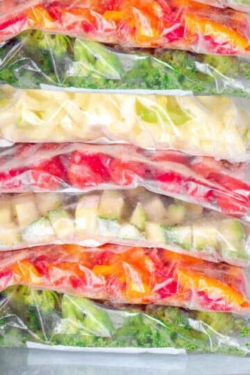 Freezer Meals for Beginners, a stack of frozen vegetables in a freezer