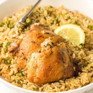 Instant Pot Chicken and Rice with a lemon wedge and a fork