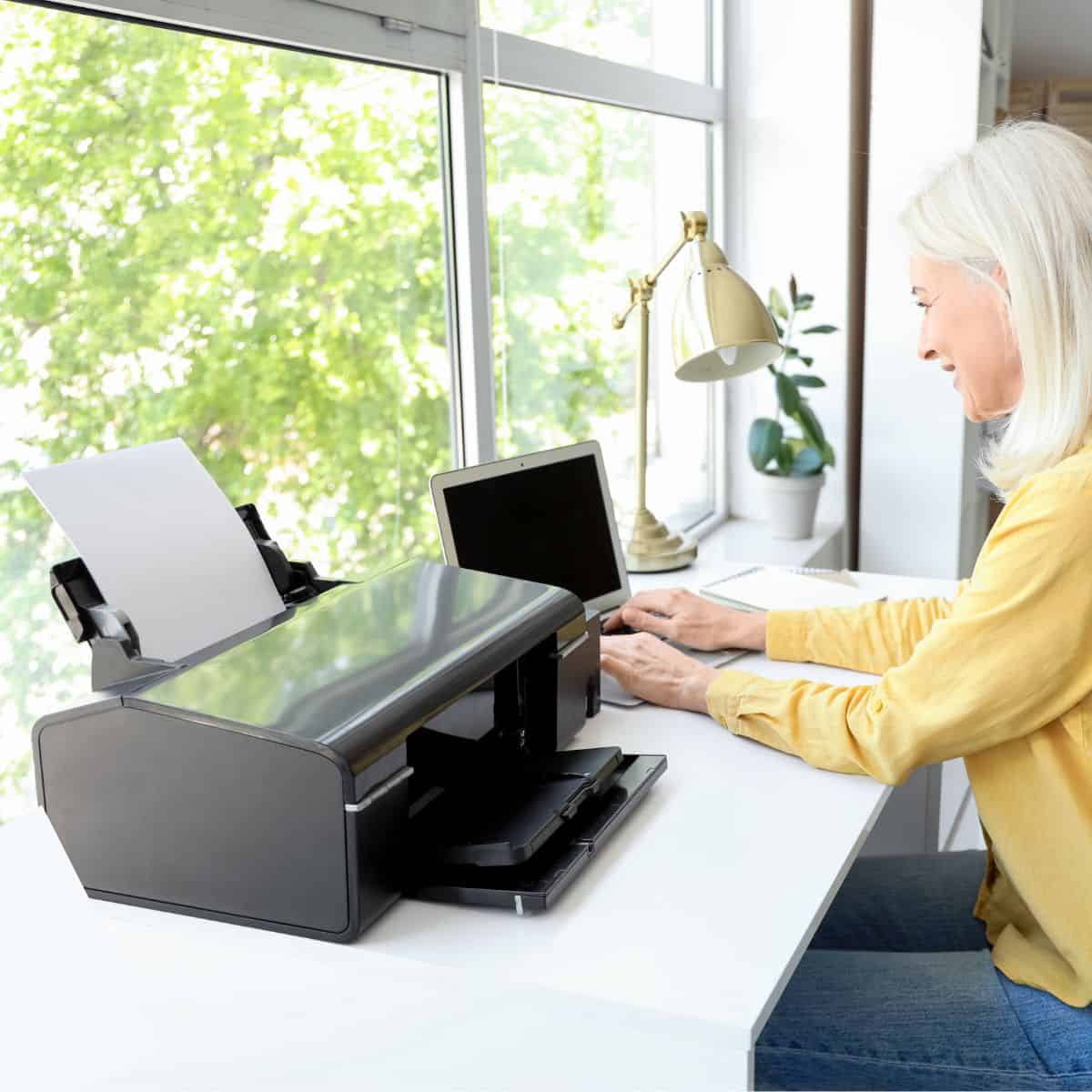 a woman printing a PDF on her home printer