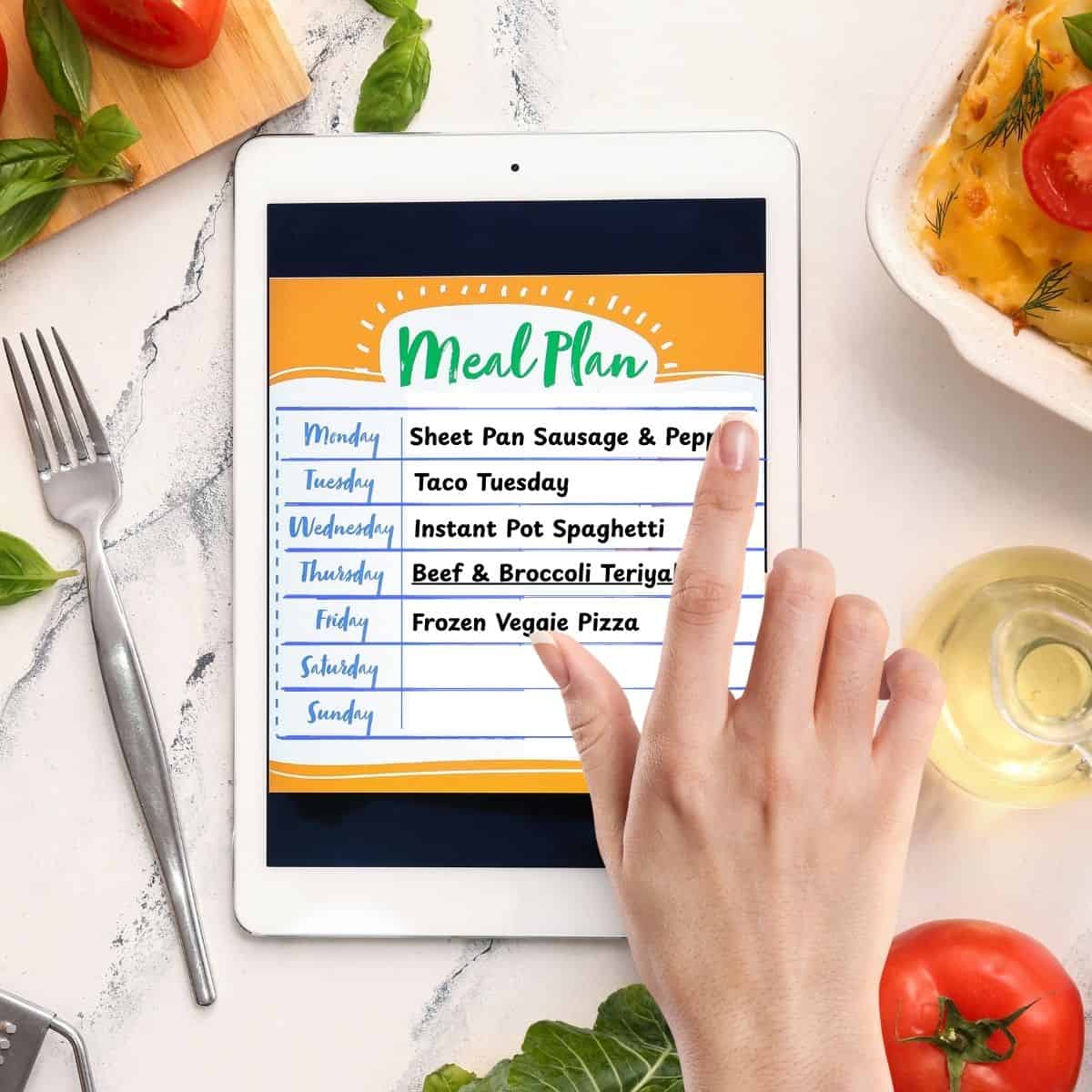 Choose 4-5 Simple Dinners Meal plan on a tablet on a white kitchen table